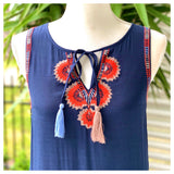 Navy Sleeveless Drop Hem Dress with Bright Orange Starburst Embroidery & Tassel Ties