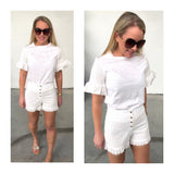 White Eyelet High Waisted Ruffle Hem Shorts with Button Detail